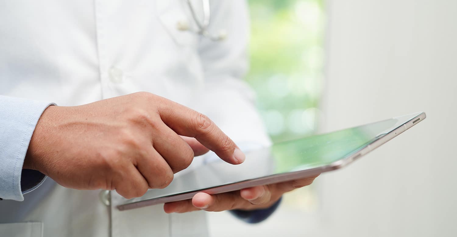 Close-up of a professional using a tablet